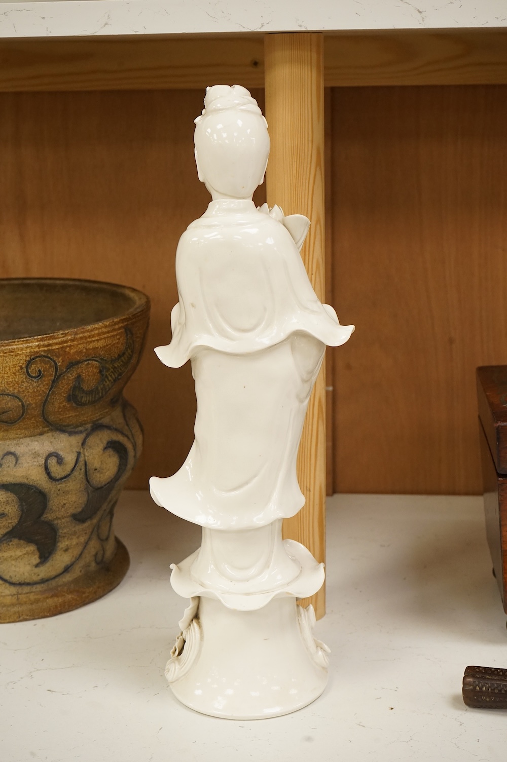 A Chinese blanc de chine figure of Guanyin, 42cm high